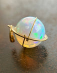 Ethiopian opal orb pendant set in 18k gold