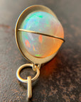 Ethiopian opal orb pendant set in 18k gold