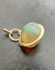 Ethiopian opal orb pendant set in 18k gold