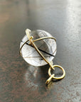 black tourmaline in quartz orb set in 18k gold pendant