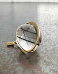 black tourmaline in quartz orb set in 18k gold pendant