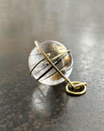 black tourmaline in quartz orb set in 18k gold pendant