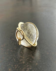 rutilated quartz orb pendant in 18k gold setting