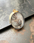 dendritic quartz pendant in a gold setting