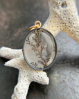 dendritic quartz pendant in gold setting