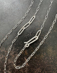 mother of pearl carved pendant with silver 3 way paperclip chain