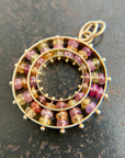sapphire bead pendant with concentric circles of 14k gold