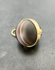 banded saturn agate pendant in 18k gold