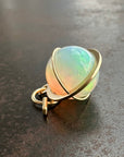 opal orb pendant Captured in 18k gold