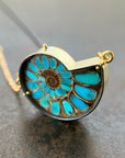 ammonite with embedded turquoise necklace in silver and gold on silver and gold chain