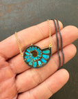 ammonite with embedded turquoise necklace in silver and gold on silver and gold chain