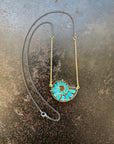 ammonite with embedded turquoise necklace in silver and gold on silver and gold chain