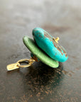 chinese hand carved turquoise beads with an 18k gold bale.