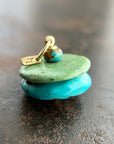 chinese hand carved turquoise beads with an 18k gold bale.