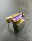 purple wood opal set in an 8k gold ring