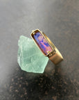 purple wood opal set in an 8k gold ring