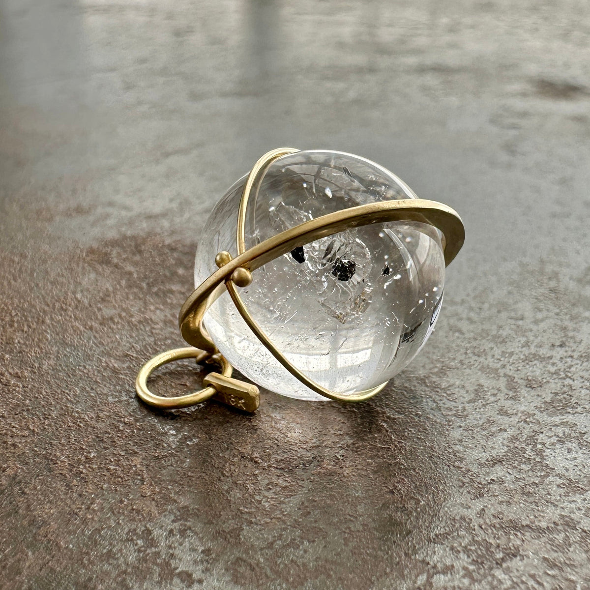 enhydro quartz orb pendant in 18k gold