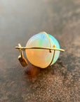 Ethiopian opal orb pendant set in 18k gold  