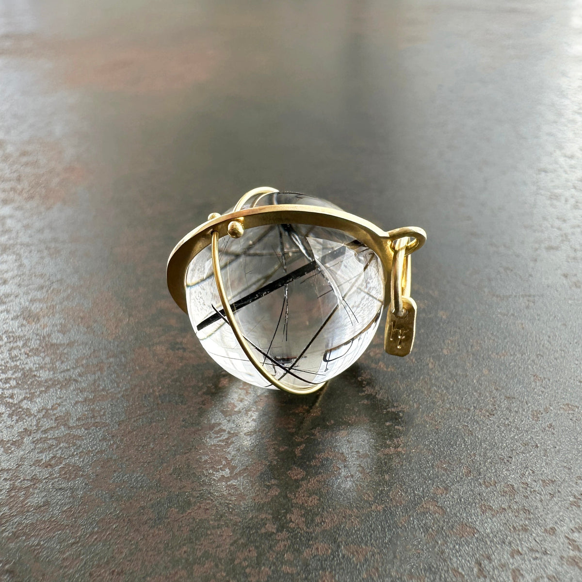 black tourmaline in quartz orb set in 18k gold pendant