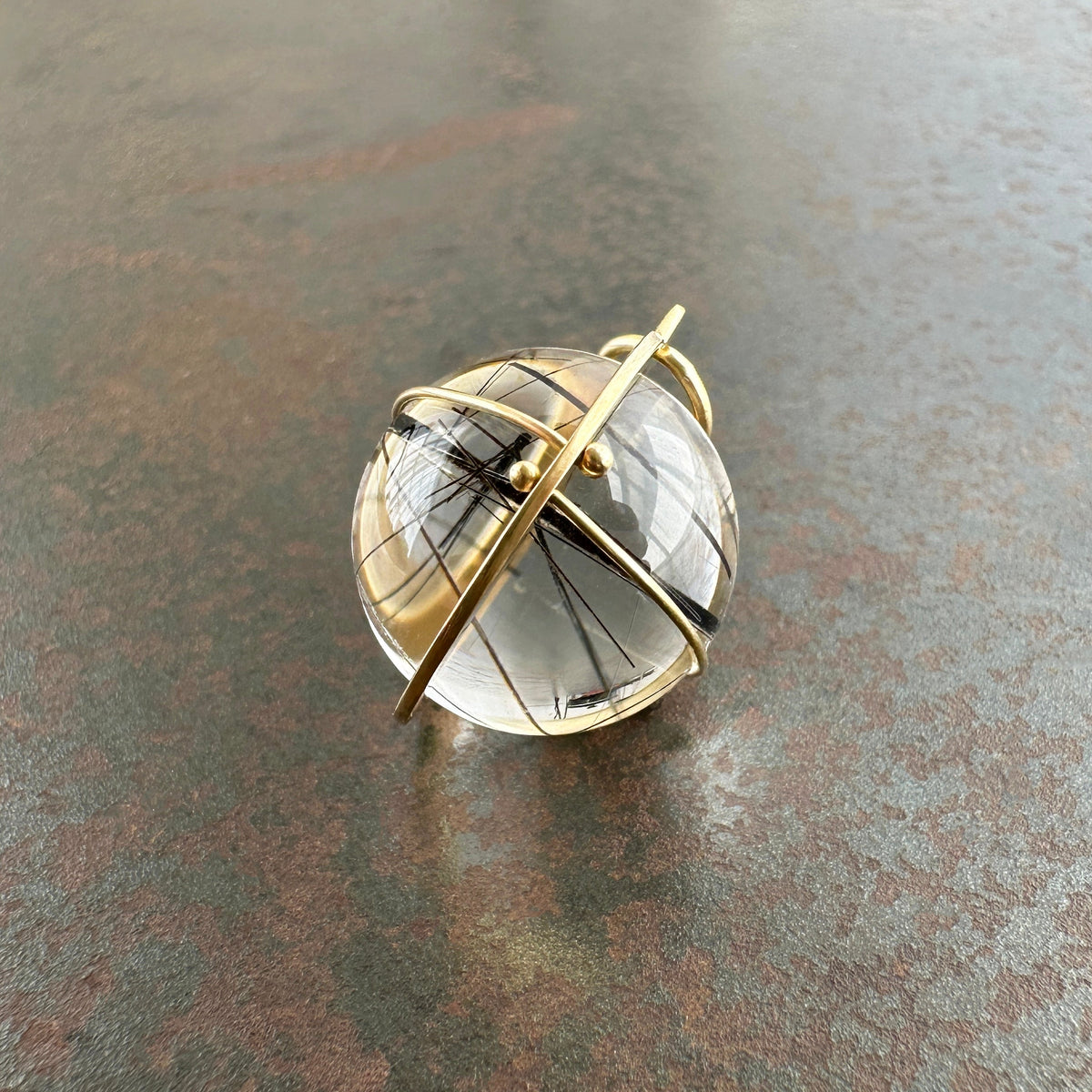 black tourmaline in quartz orb set in 18k gold pendant