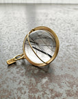 black tourmaline in quartz orb set in 18k gold pendant