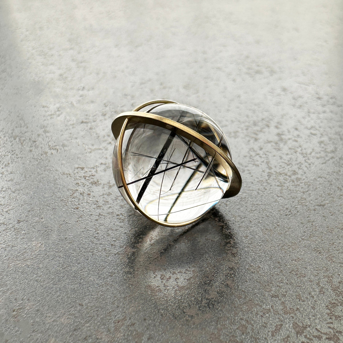 black tourmaline in quartz orb set in 18k gold pendant
