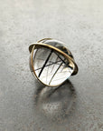 black tourmaline in quartz orb set in 18k gold pendant