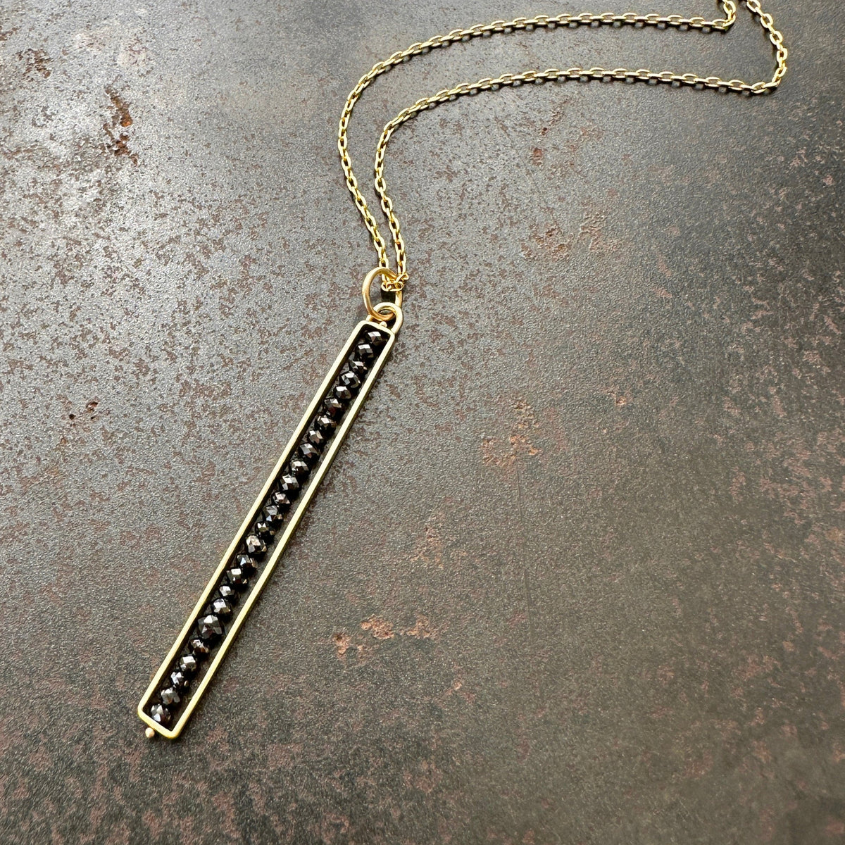 Black Diamond Beaded Stick Pendant