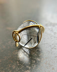 black tourmaline in quartz orb captured in 18k gold pendant