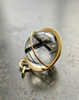 black tourmaline in quartz orb captured in 18k gold pendant