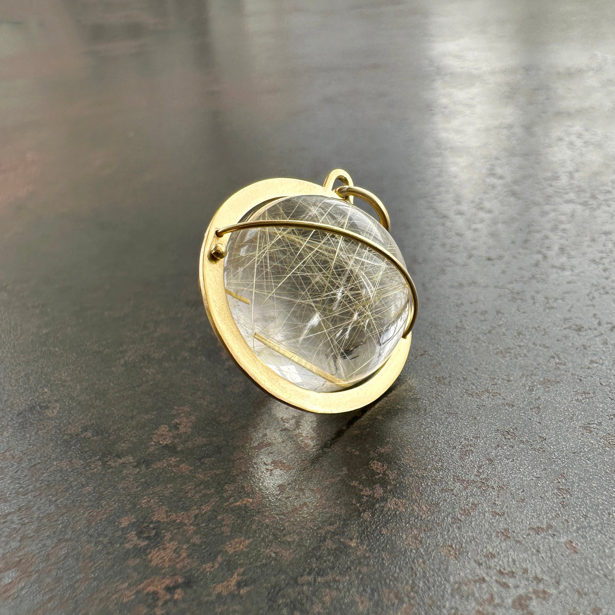 rutilated quartz orb pendant in 18k gold setting