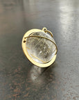 rutilated quartz orb pendant in 18k gold setting