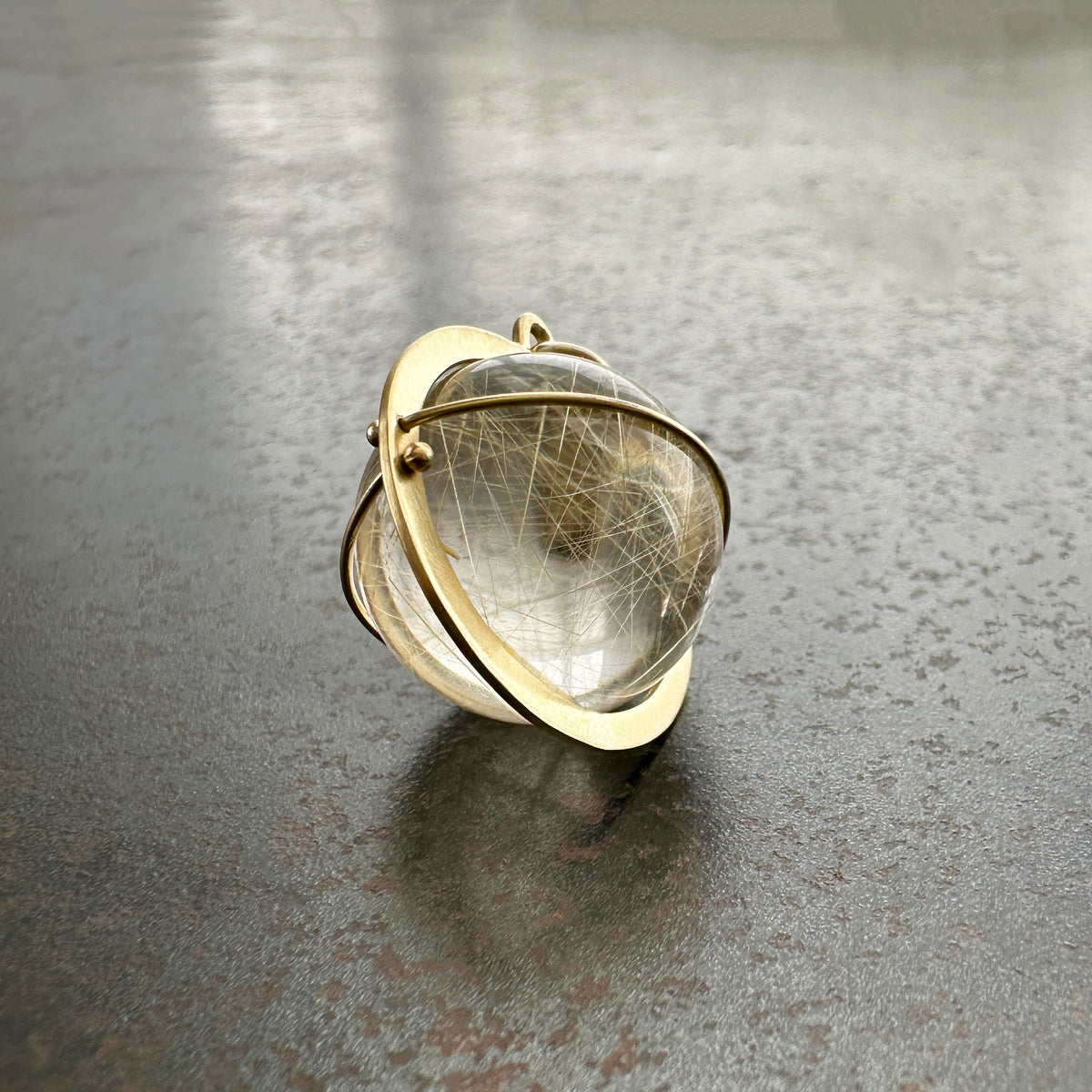 rutilated quartz orb pendant in 18k gold setting