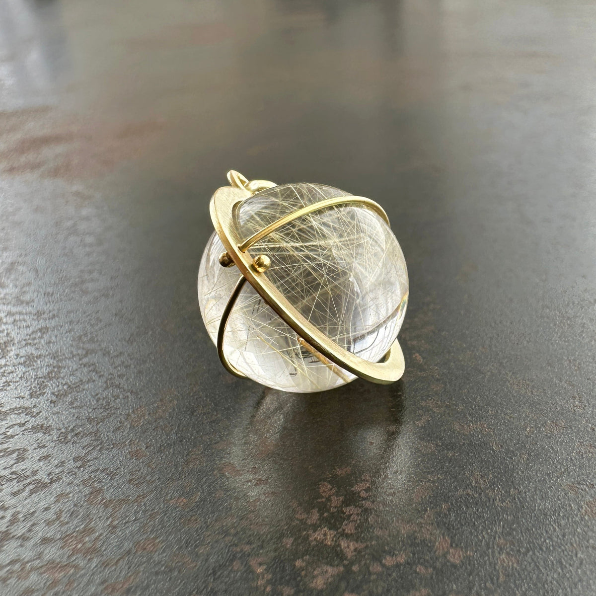rutilated quartz orb pendant in 18k gold setting