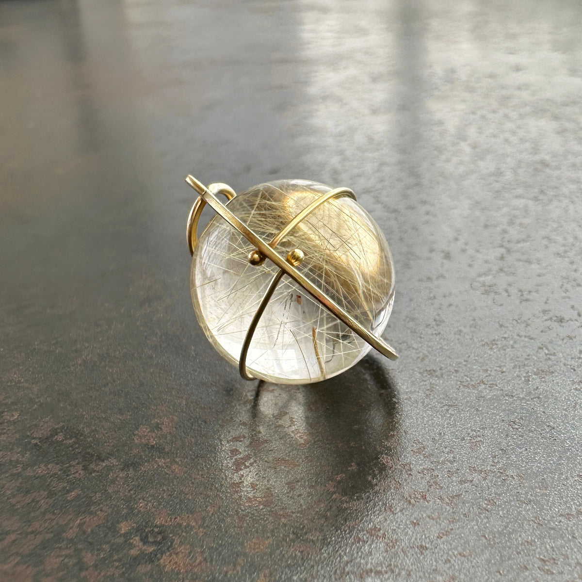 rutilated quartz orb pendant in 18k gold setting