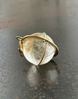 rutilated quartz orb pendant in 18k gold setting