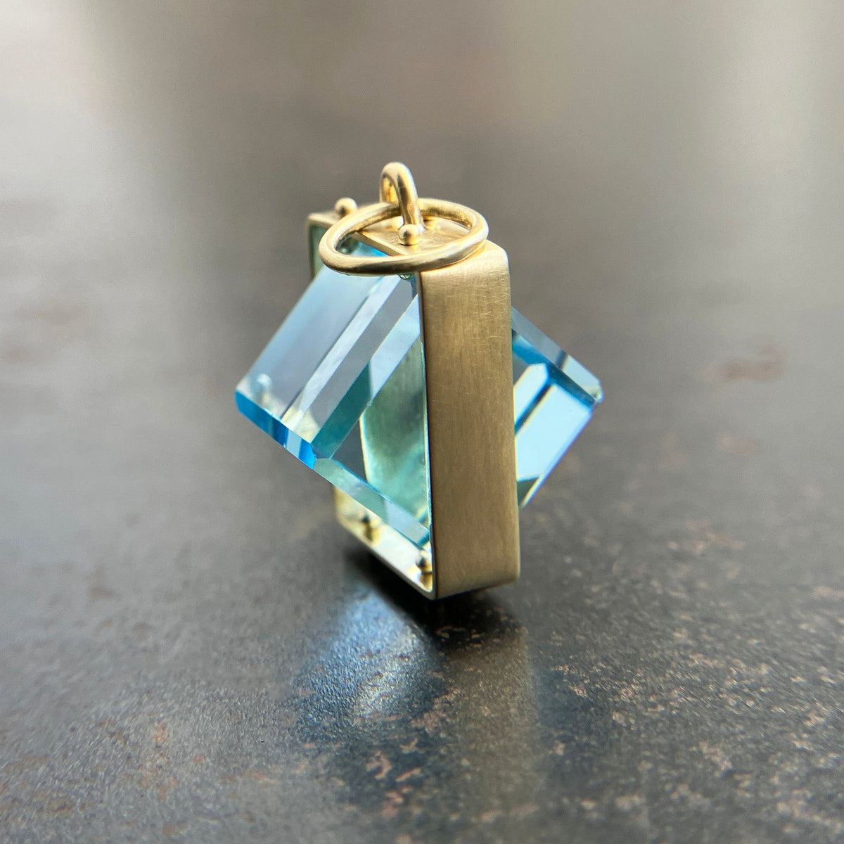 blue topaz cube pendant in 18k gold