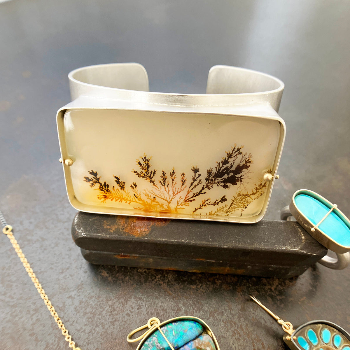 silver cuff bracelet with dendritic agate stone