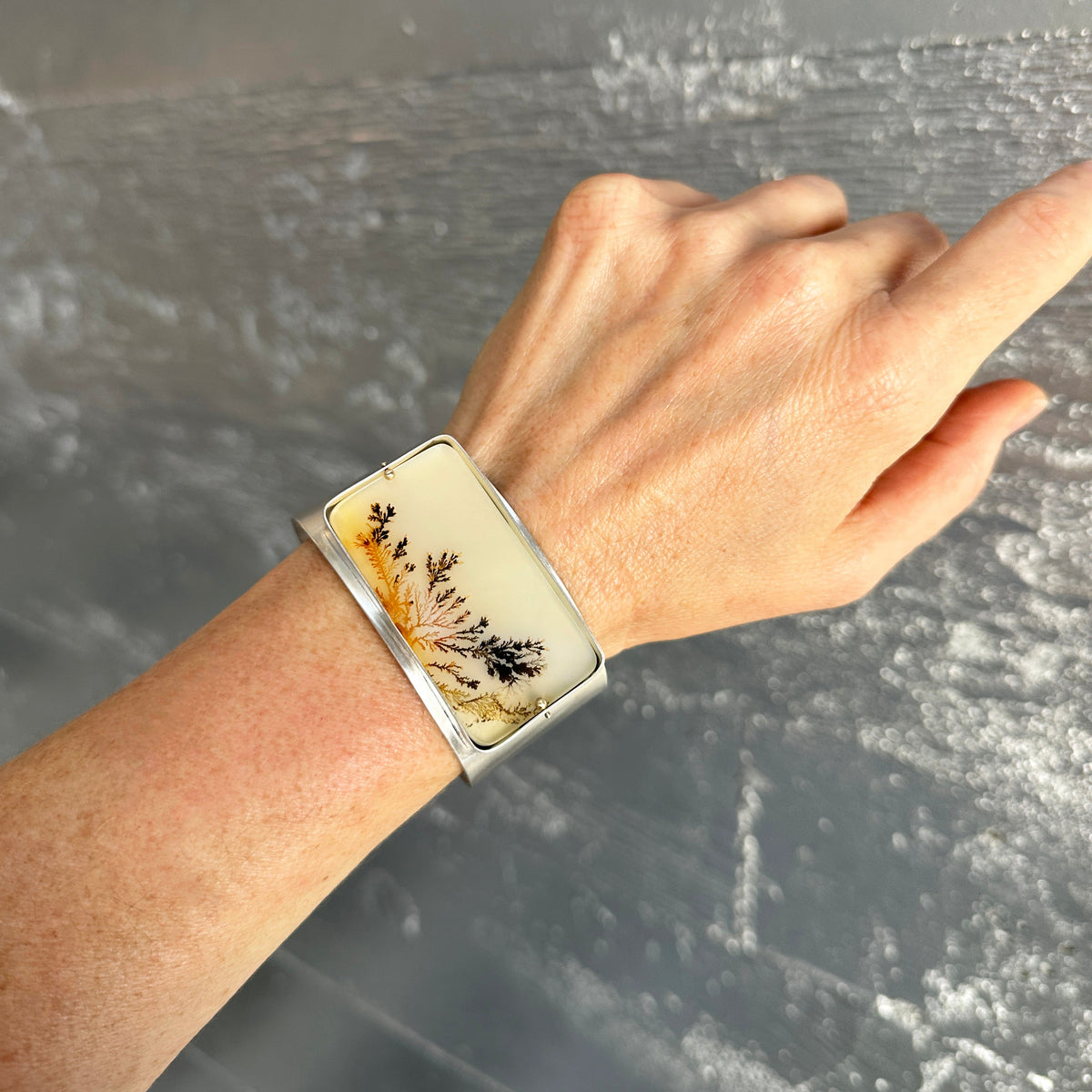 silver cuff bracelet with dendritic agate stone