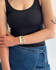model wearing a silver cuff bracelet with dendritic agate stone