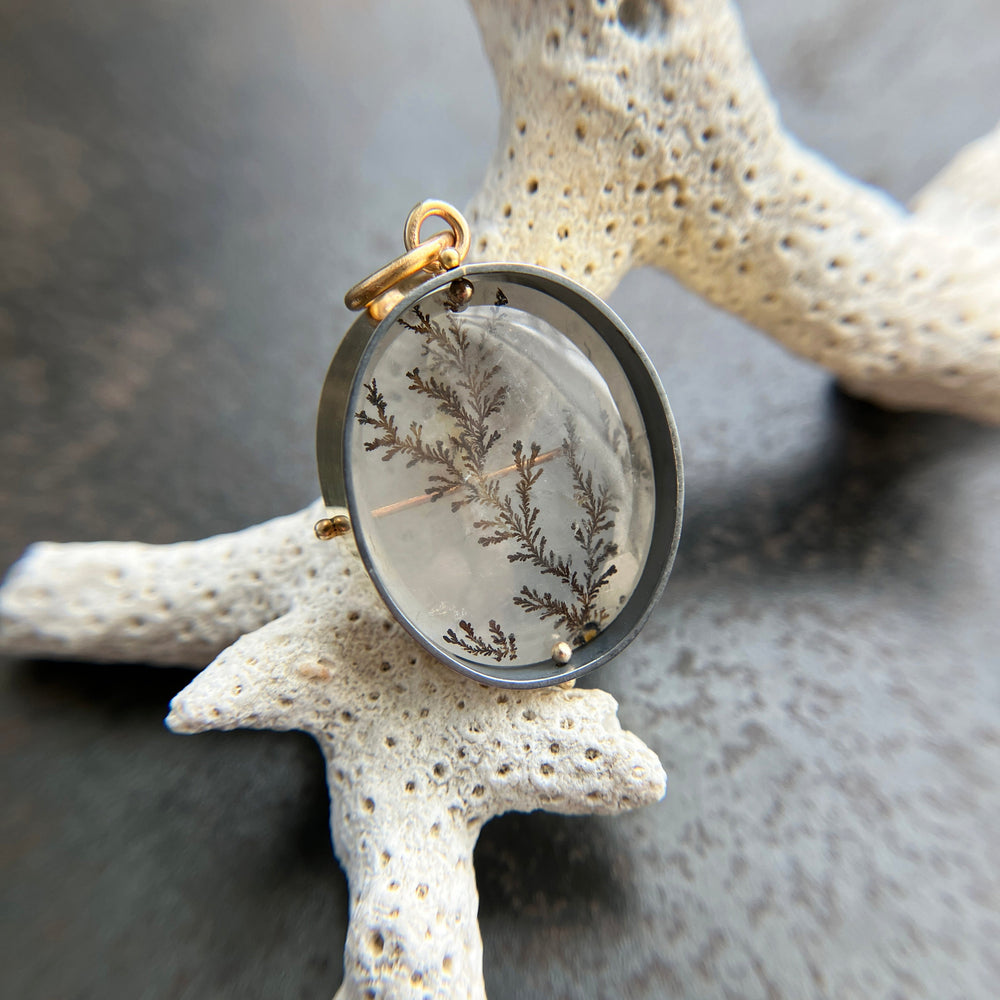 dendritic quartz pendant in gold setting