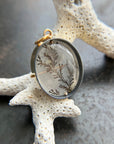 dendritic quartz pendant in gold setting