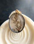dendritic quartz pendant in gold setting