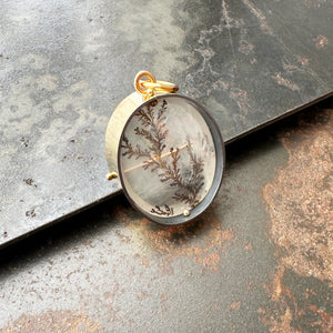 dendritic quartz pendant in a gold setting