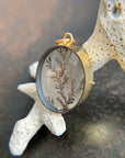dendritic quartz pendant in gold setting