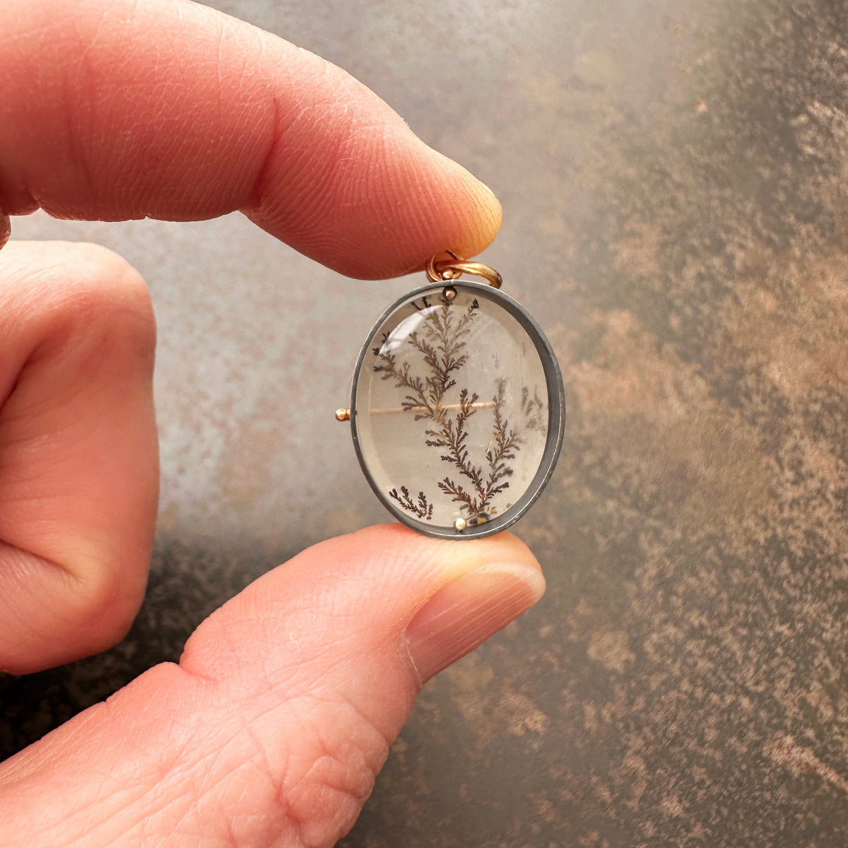 dendritic quartz pendant in gold setting