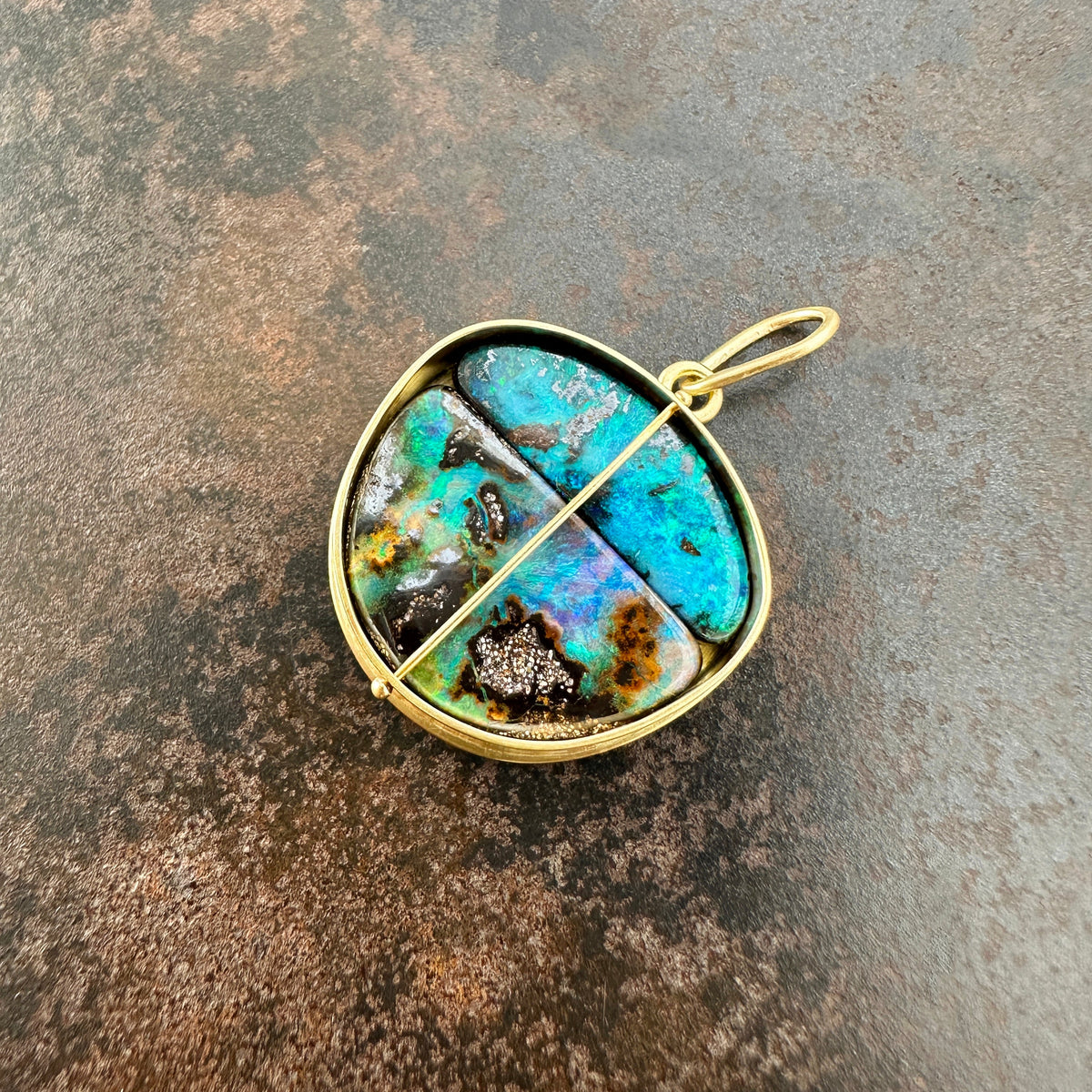 gold pendant with two boulder opals