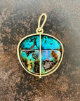 gold pendant with two boulder opals