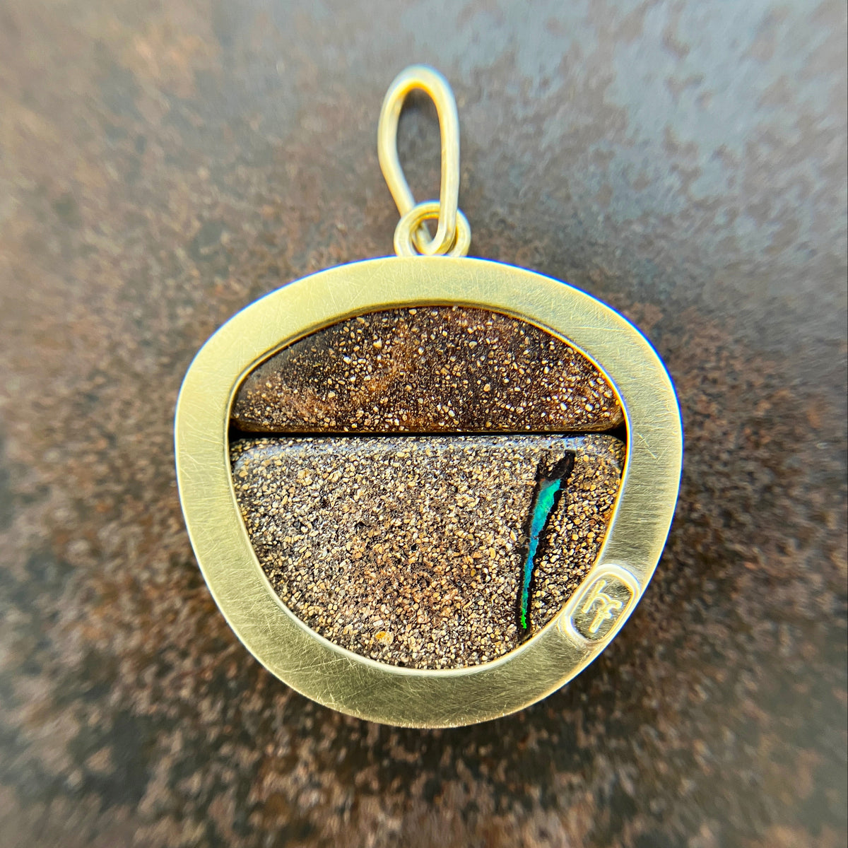 gold pendant with two boulder opals
