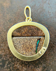gold pendant with two boulder opals